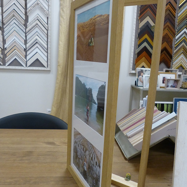 Un cubre contadores de madera con tres fotos en la portada